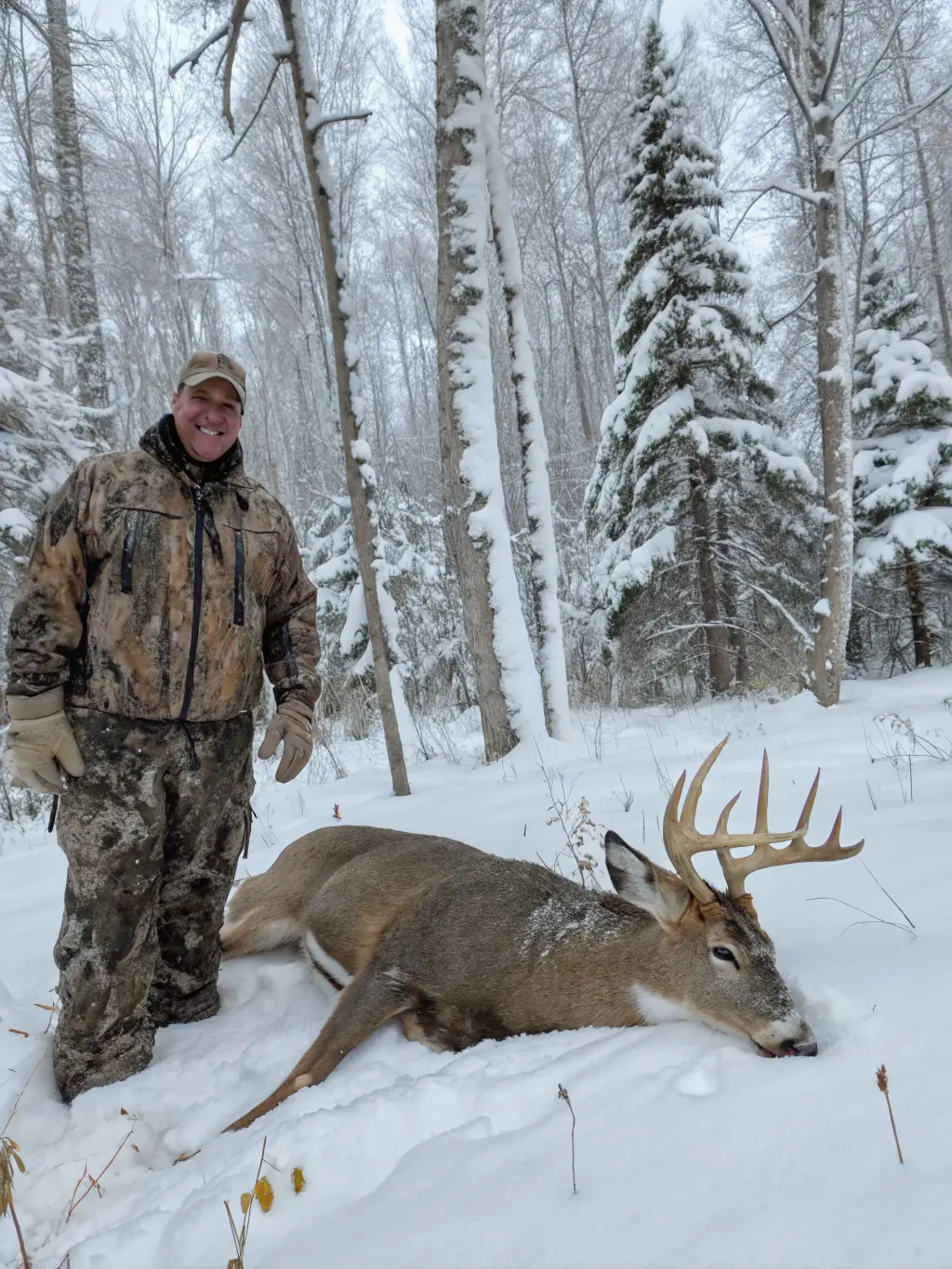 A photograph capturing a group of hunters in camouflage gear, standing proudly next to a recently hunted deer in a forest clearing during a SCSC organized deer hunting program.